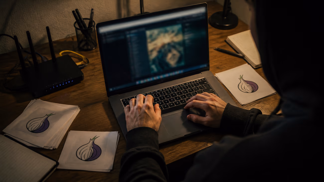 individual exploring dark web content on laptop